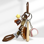 A baseball-themed keychain with a brown carabiner clip, featuring a yellow star charm, a brown coffee cup charm with "coffee" text, a brown leather baseball glove, a wooden baseball bat, and a white baseball with red stitching, attached to a braided rope strap.