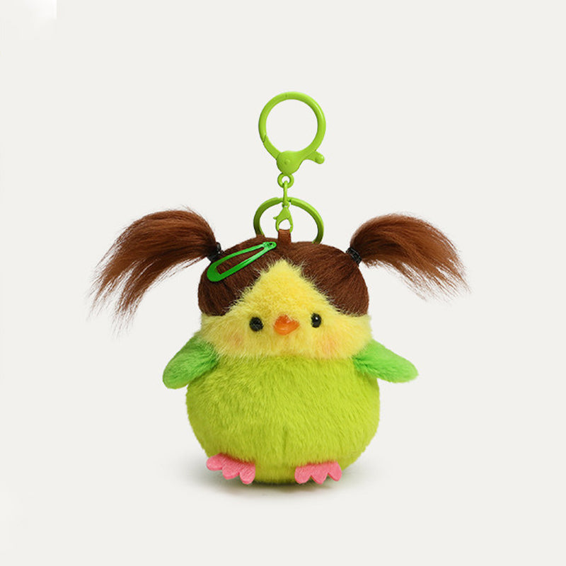 A plush bird keychain with a lime-green body, yellow head, and green wings. It has brown, pigtails, a green hair clip, and a green metal clasp.