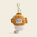 A plush cat bag charm inside a golden-brown taiyaki-shaped costume with embroidered whiskers and pink paw details. It is attached to a gold lobster clasp and keyring, designed as a cute and trendy accessory for bags or keychains.