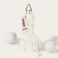 A white plush guitar-shaped keychain with brown embroidered details, hanging from a silver carabiner with a white braided rope strap and white plastic beads.